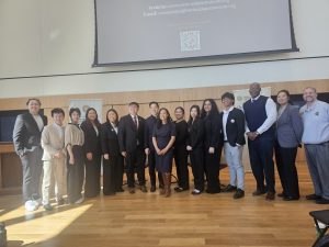 More than a dozen Asian Pacific Americans and supporters stand together for a group photo. Chuck Grigsby is third from the right.